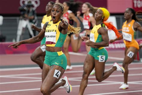 Thompson-Herah breaks Flo Jo's Olympic record in women's 100 | AP News