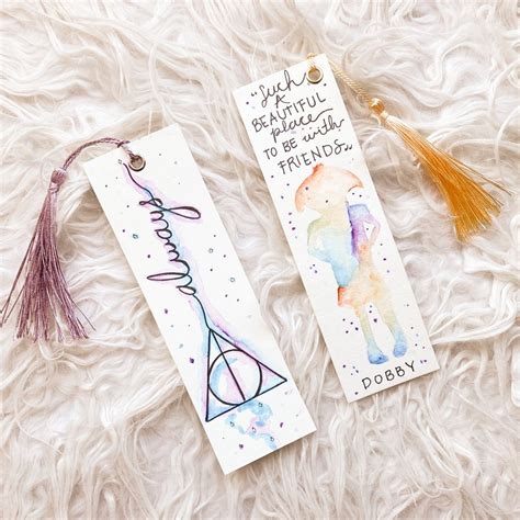 I made some sort of minimalist harry potter watercolour bookmarks i think they’re kinda neat ...