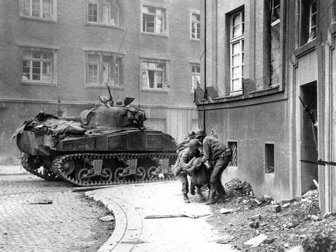 American soldiers carry their wounded comrade to safety. Battle of Aachen, October 1944. | Война