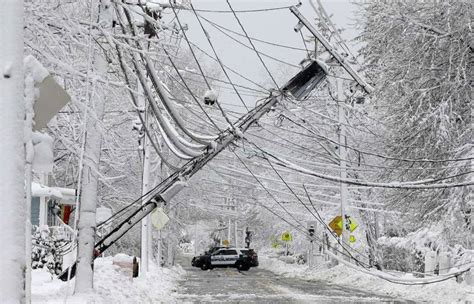 Storm Damage > Natick, MA Tipped Utility Pole with 4kv Distribution