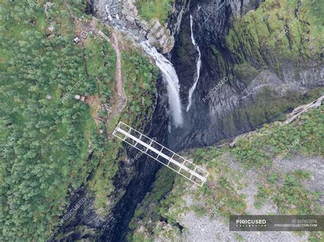 Bridge over spectacular ravine and waterfall in nature — terrain, scenery - Stock Photo | #237453376