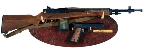 Hake's - “JOHNNY EAGLE LIEUTENANT” TOY RIFLE AND CAP PISTOL DISPLAY.