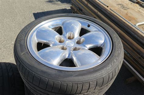 Qty 4 Bridgestone Tires 275/40R20 107Y on Chrome Rims - Oahu Auctions