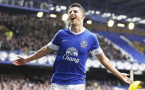 Everton goalscorer Kevin Mirallas steps out of Marouane Fellaini's ...