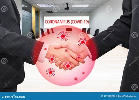 Covid-19 and Coronavirus ,Virus in Hands Concept. Business People Shaking Hands Traditional in ...