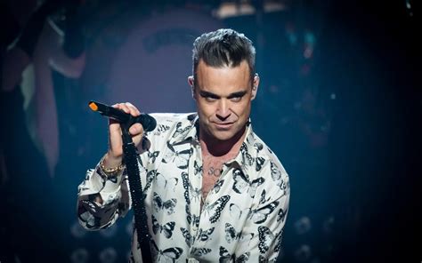 Robbie Williams may dance like a drunk dad at a disco, but he dazzled at the Roundhouse – review