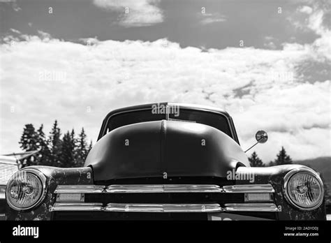 classic old American pickup car front low angle view, headlights light lamps and chrome view ...