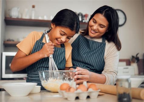 Premium Photo | Bakery baking and woman with girl learning to bake cooking skill and development ...