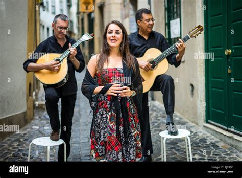 Fado band performing traditional portuguese music on the narrow street of Alfama, Lisbon ...