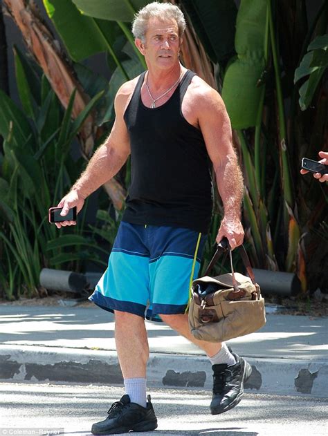 Mel Gibson, 58, shows off his bulging biceps after finishing up a ...