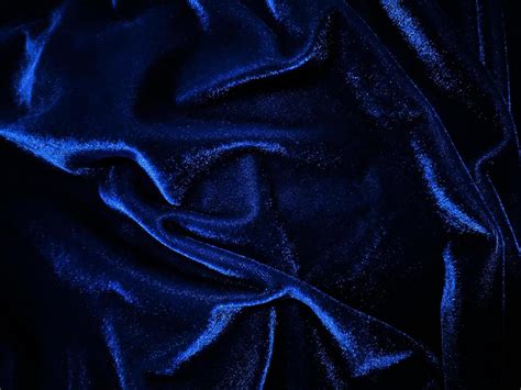 Blue velvet fabric texture used as background. Empty blue fabric ...