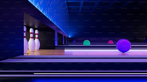 A bowling alley filled with bowling balls and bowling pins photo ...