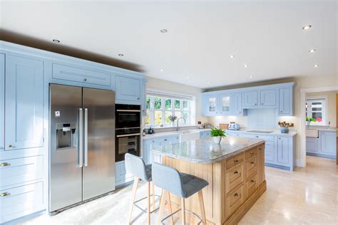 Bright and airy blue in-frame shaker kitchen with oak kitchen island ...