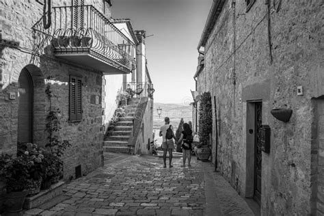 Rear View of People in the Streets of Pienza in Tuscany Italy Stock Image - Image of stone ...