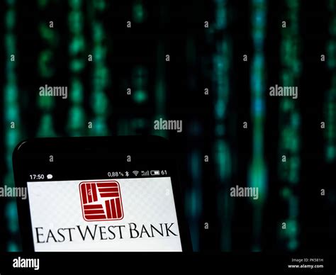 East West Bank logo seen displayed on a smart phone Stock Photo - Alamy