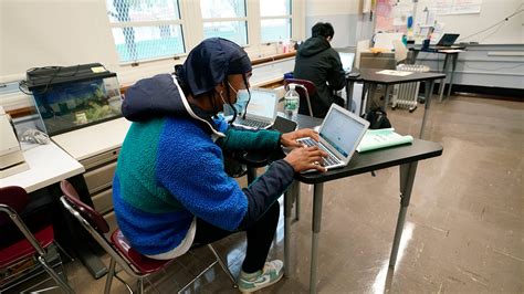 School closings: COVID cases surge. Teachers are sick. Back to online?