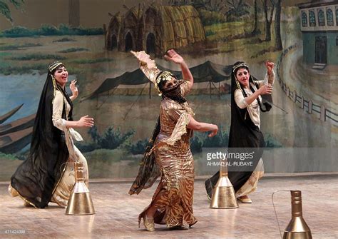 Members of an Iraqi dance group perform in Baghdad on February 21, 2014, during the closing ...