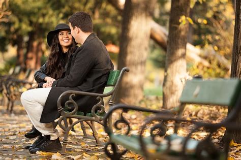 Premium Photo | Gourgeous couple sitting on a bench in autumn park