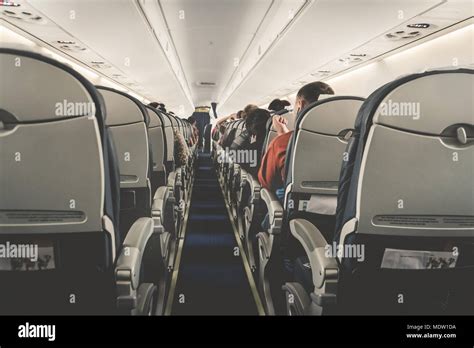 Crowded economy class plane hi-res stock photography and images - Alamy