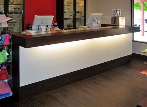 Simple, beautiful, functional Custom Multi-Station Retail Counters - Glass Showcase Retail Store ...