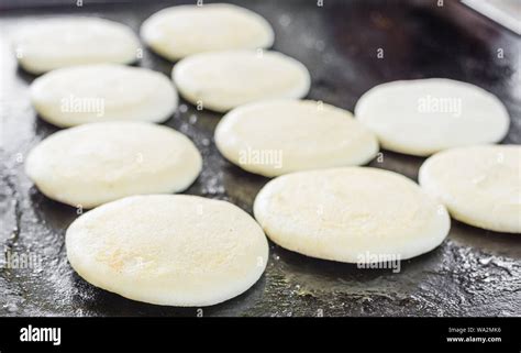 Raw uncooked arepas, traditional Colombian dish, at a street food ...