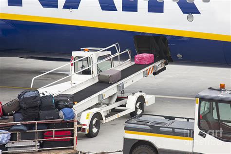 Conveyor Unloading Luggage Photograph by Jaak Nilson