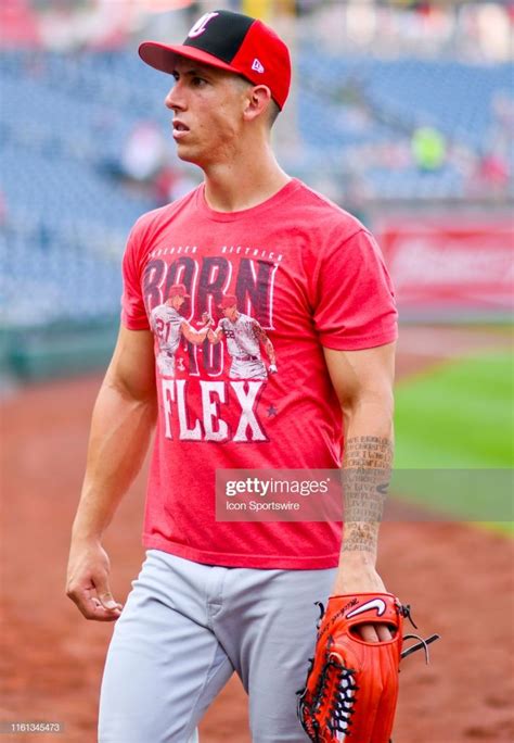 Cincinnati Reds relief pitcher Michael Lorenzen walks into the dugout... | Cincinnati reds ...