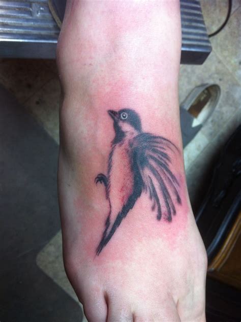 Bird tattoo on foot | Tattoos, Birds tattoo, Foot tattoos