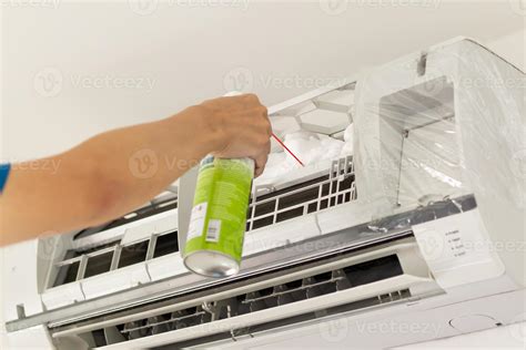 air conditioner cleaning with spray foam cleaner 13008656 Stock Photo at Vecteezy