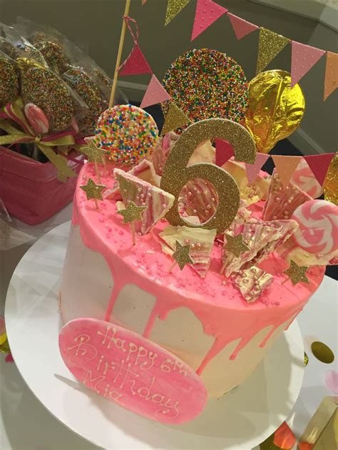 Hot pink drip cake with gold glitter decorations | Drip cakes, Pink ...