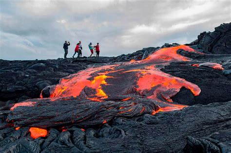 Daring tourists hike on ACTIVE volcano in Hawaii to get as close as possible to the lava flows ...