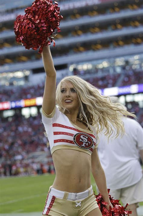 A San Francisco 49ers cheerleader performs during the first half of an NFL football game between ...