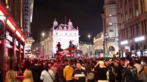 England victory: England fans celebrate in central London by jumping on ...