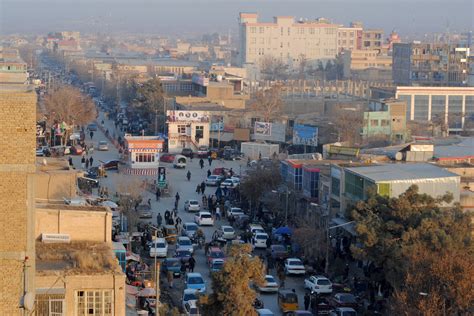 Tending to the Living and the Dead in a Battle-Torn Afghan City - The New York Times