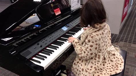 Testing piano at guitar center store. - YouTube