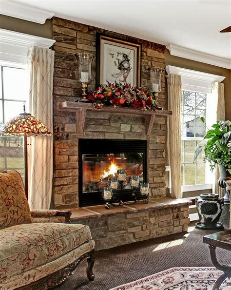 A stone fireplace adds a rustic element to an elegant room, making it a warm, inviting s ...