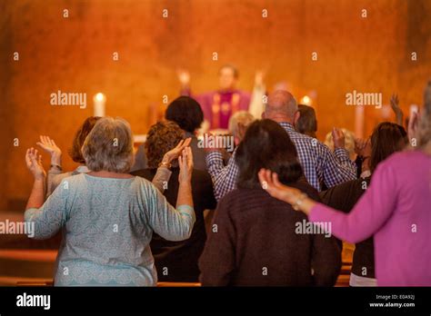 A Catholic priest offers a prayer of dismissal at the conclusion of mass in Laguna Niguel, CA ...