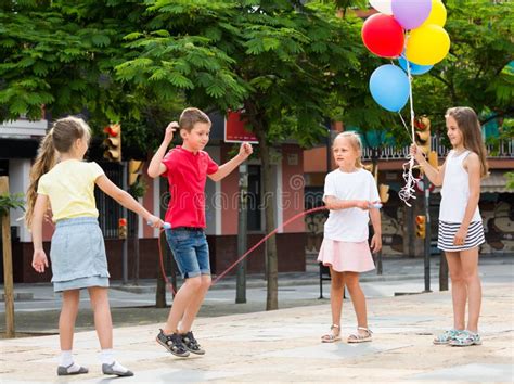 Children with Jumping Rope at Playground. Stock Image - Image of summer, laughing: 237566519