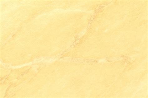 Premium Photo | Texture of light yellow marble with golden lines