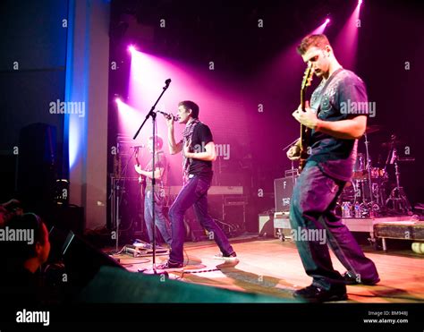 Rock band on stage Stock Photo - Alamy