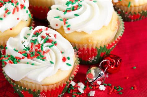 Holiday Cupcakes With Vanilla Frosting, Red And Green Sprinkles Stock ...