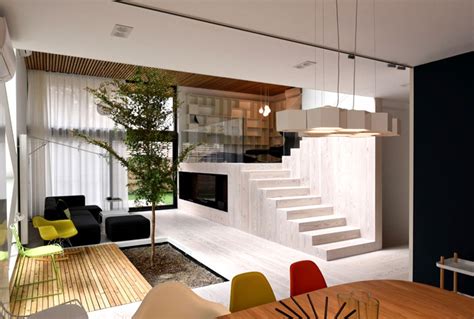 Spectacular Play of Volumes and Materials into Modern Split Level House - InteriorZine