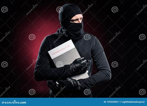 Criminal in Balaclava Holding Stock Image - Image of risk, business ...