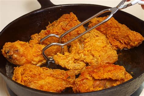 Fried Chicken Cooking In An Iron Skillet - Paisley freshmartPaisley freshmart