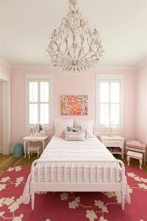 Girls room chandelier white antique bed dark pink rug pale pink walls colorful painting by ...