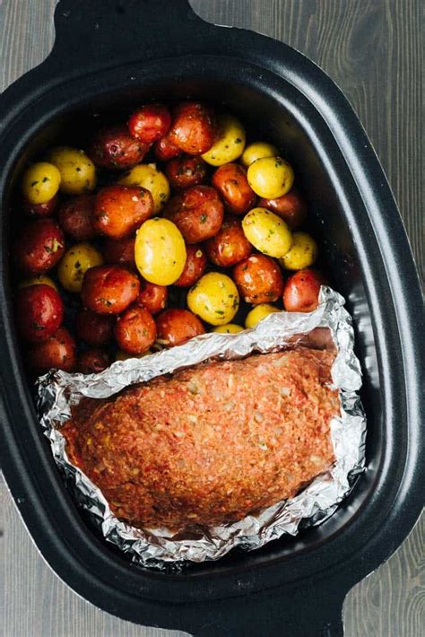 Slow Cooker Meatloaf and Potatoes and garlic butter. Tender and Perfect!