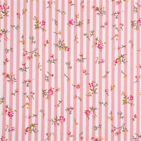 a pink and white striped wallpaper with flowers on the bottom, stripes in the background