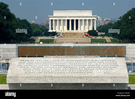 Inscription on the World War II Memorial, the Lincoln Memorial behind, Washington DC, USA ...