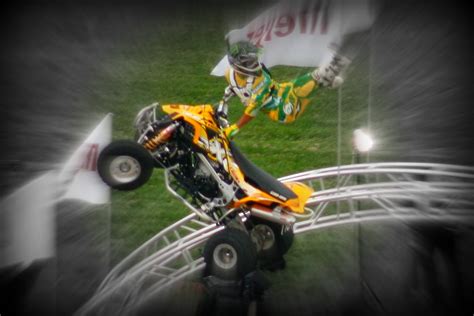 ATV Stunt | An ATV rider performs a stunt after jumping a ra… | Flickr