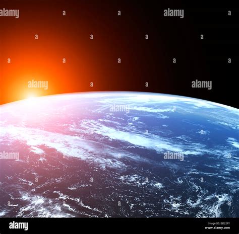 NASA view of earth at sunrise from space Stock Photo - Alamy